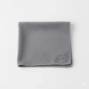 Close-up of a premium microfiber camera lens cleaning cloth folded neatly, highlighting the soft, lint-free texture ideal for sensitive camera equipment.