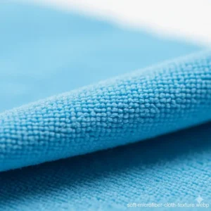 Close-up shot of the soft, tightly woven material of a microfiber eyeglass cleaning cloth designed for safe use.
