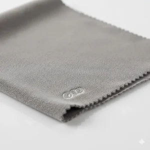 Close-up of a premium, non-abrasive microfiber product shot of a camera lens cleaning cloth.