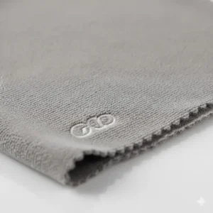 Highly magnified view of the ultra-fine woven texture of the camera lens cleaning cloth material, showing its lint-free quality.