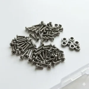 A variety of stainless steel replacement screws and nuts included in a reading glasses repair kit.