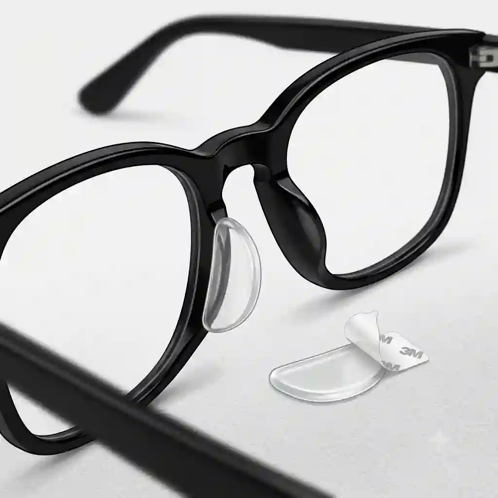 Clear silicone eyeglass stick on nose pads applied to black frames for anti-slip protection.